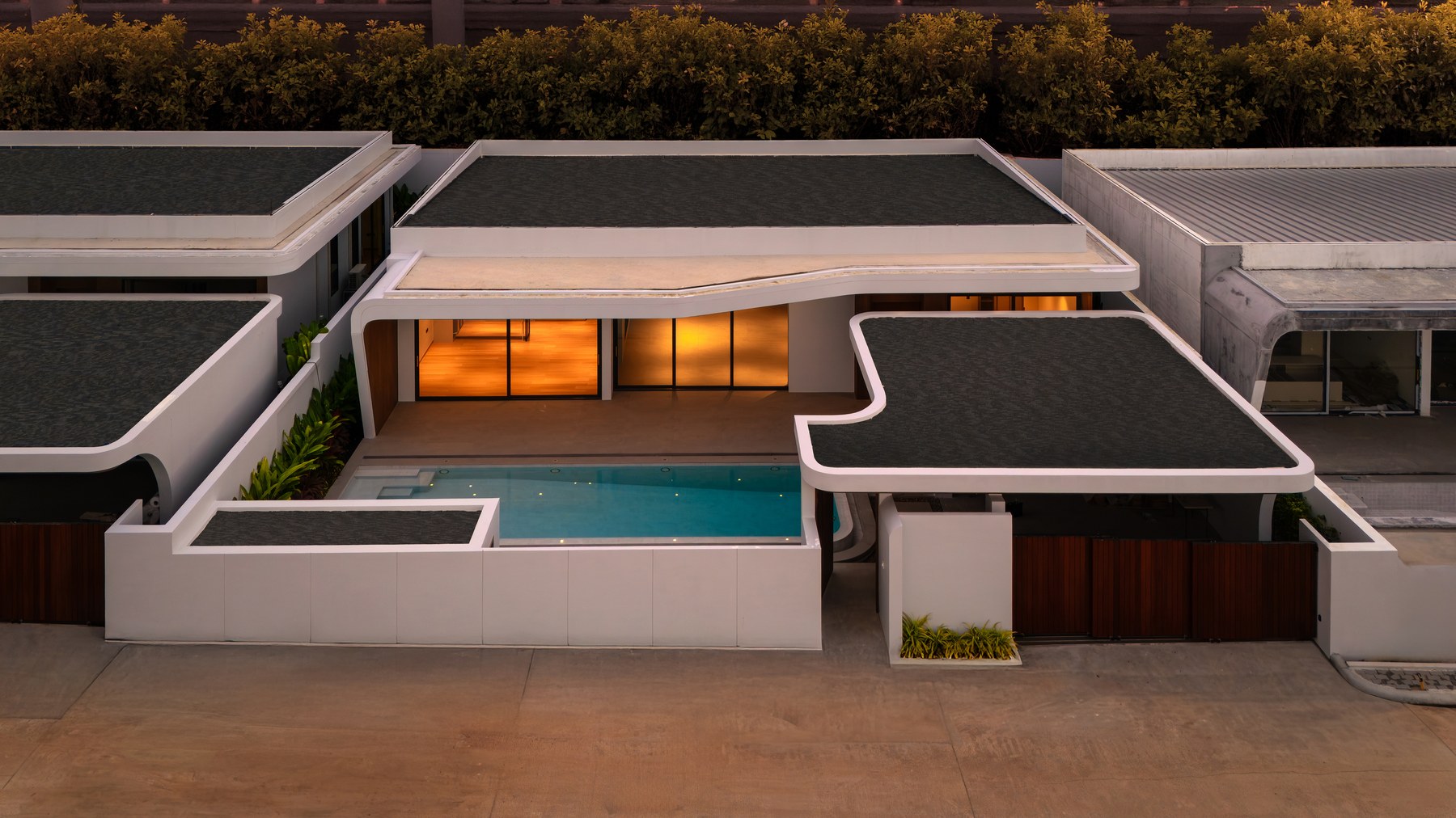 Clover Residence — aerial view of the villa community at sunset